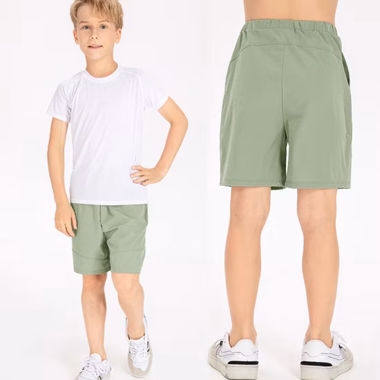 Usine de gros décontracté jeunes garçons coupe ample short athlétique coffre à séchage rapide pantalon court avec poche garçons skateboard actif short de basket-ball